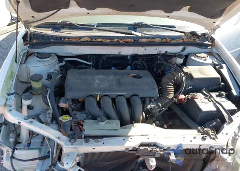 2004 Toyota Corolla Le z USA, uszkodzony, nr VIN JTDBR32E840052765